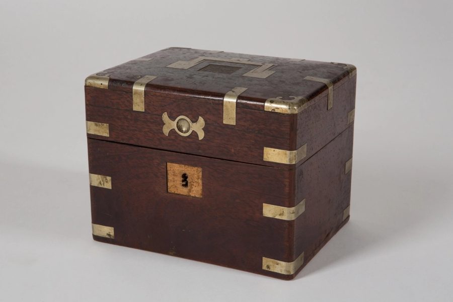 Wooden jewellery box with brass corners